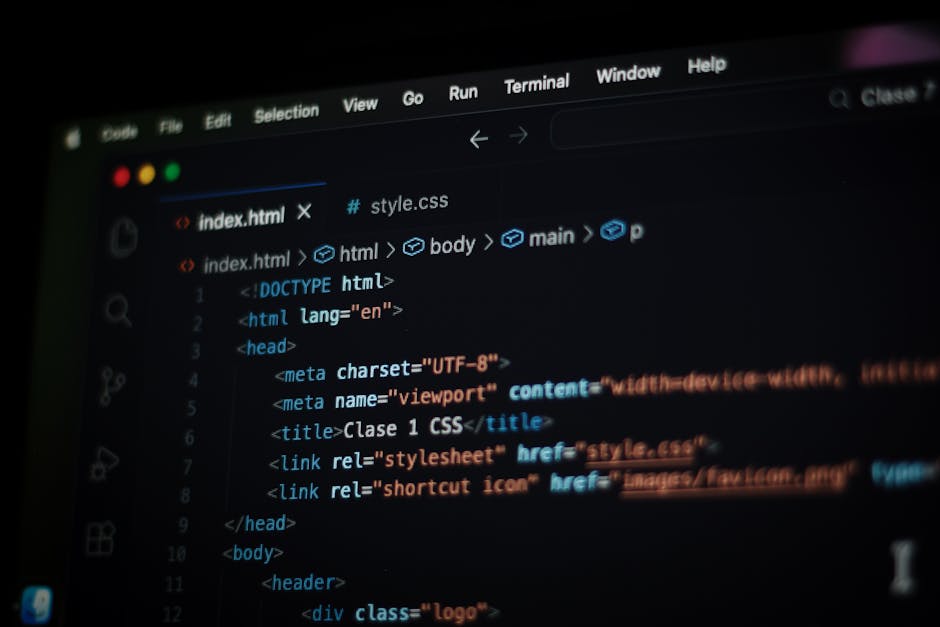 A dark laptop with a glowing red and turquoise screen displaying lines of code, positioned on a flat surface. To the right of the laptop, there is a white Puma baseball cap with a black Puma logo, par