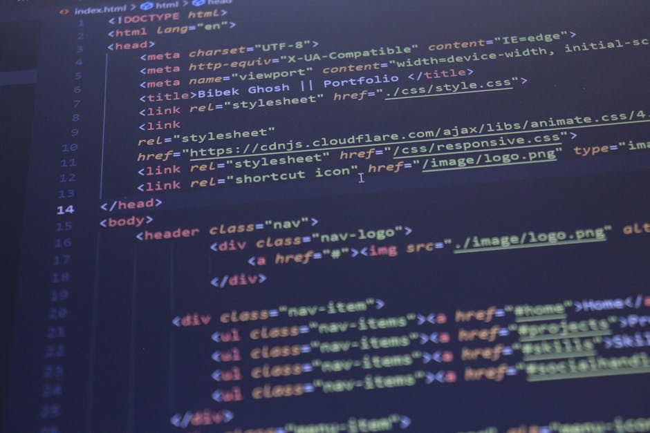 Close-up view of a computer screen displaying lines of colour-coded HTML coding in a dark interface, with text including tags such as <div>, <h1>, and <img>, highlighting website dev